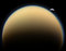 What's that behind Titan?  It's another of Saturn's moons: 