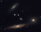 Sometimes galaxies form groups.  For example, our own